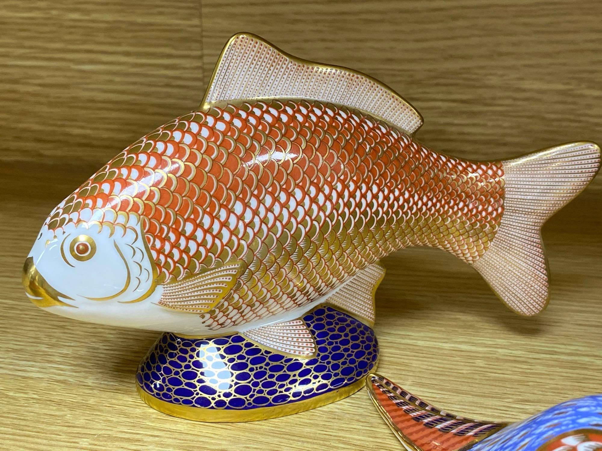 A graduated set of Beswick flying ducks and five Royal Crown Derby animal paperweights and another similar rabbit, fish 18cm